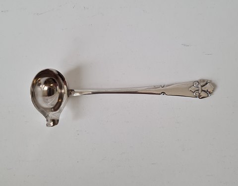 French lily cream spoon in silver from 1923