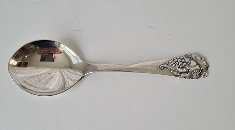 Silver serving spoon decorated with grape bunch from 1950
