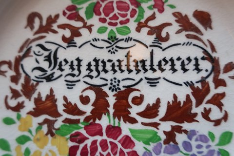 An old beautiful plate with the text "Jeg gratulerer" (I congratulate)In a good condition