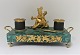 Lundin Antique 
presents: 
Ink house 
with base of 
malachite, and 
gilded soldier. 
Length 28 cm. 
Width 14 cm. 
...