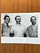 NASA: Small original black and white photograph of the three Apollo 11 astronauts Neil Armstrong, Mike Collins and Edwin Aldrin, gelatin silver, July 1969 with the Apollo V rocket in the background