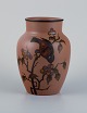 Hjorth Bornholm, Denmark, handmade ceramic vase decorated with a bird on a branch.