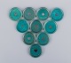 Wilhelm Kåge for Gustavsberg, Sweden. A set of ten "Argenta" coasters/bottle trays.