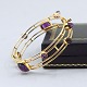 Bent Knudsen; Bangle of 14k gold set with amethyst