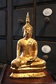 Gammel orientalsk buda i forgyldt jern. H: 22,5cm.
