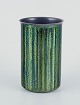 L'Art presents: 
Norwegian 
designer.
Enameled 
copper vase.
Cylindrical 
shape. Glossy 
green and blue 
tones.
