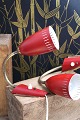 A pair of old retro wall lamps in red painted metal and brass from the 50s.
