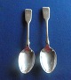 Pair of children's spoons in English sterling silver. L approx. 14cm & approx. 15cm.