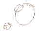 Anni & Bent Knudsen sterlingsølv smykkesæt bestående af cirkelformet arm- og fingerring begge monteret med to mindre bevægelige cirkler. Armring indv. D: 6,5cm. Ringstr. 51