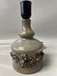 Table lamp in ceramic, raw knobbed structure with light and dark glazeHeight 24.0 cm.