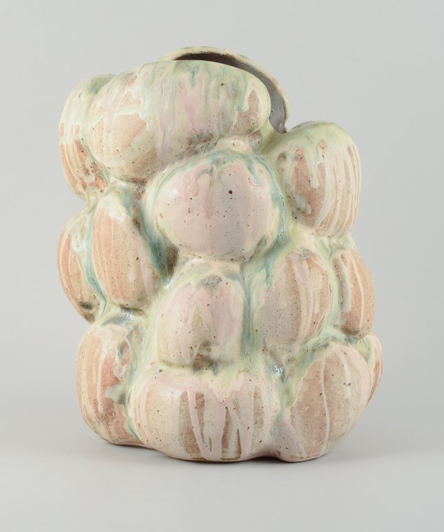 Christina Muff, Danish contemporary ceramicist (b. 1971). Monumental organically shaped vase. This piece is covered in multicolored pastel glaze, the clay showing between glaze runs.