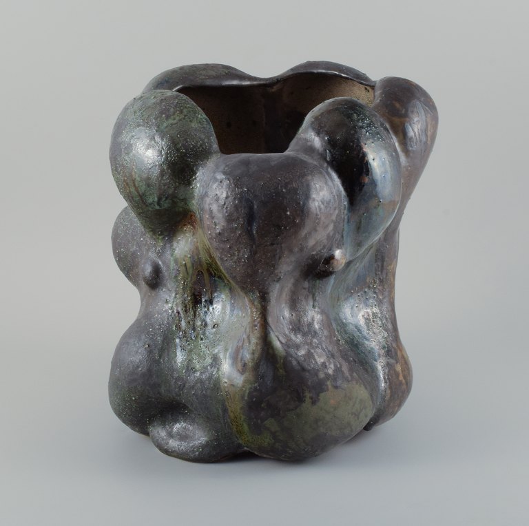 Christina Muff, Danish contemporary ceramicist (b. 1971). Monumental work in stoneware clay, covered in blackish green glaze with the occasional specks of blue on a semi-rough surface.