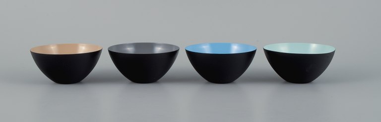 Four small bowls in metal.Brown, grey, blue and mint green.