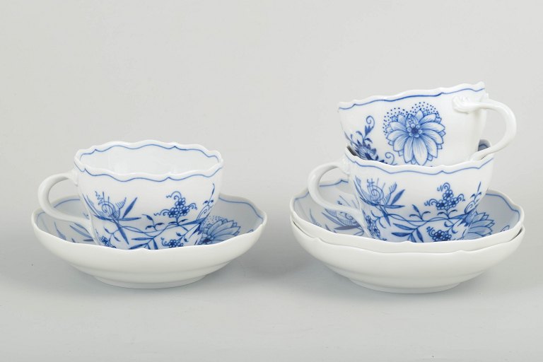 Meissen Blue Onionthree coffee cups with matching saucers.
