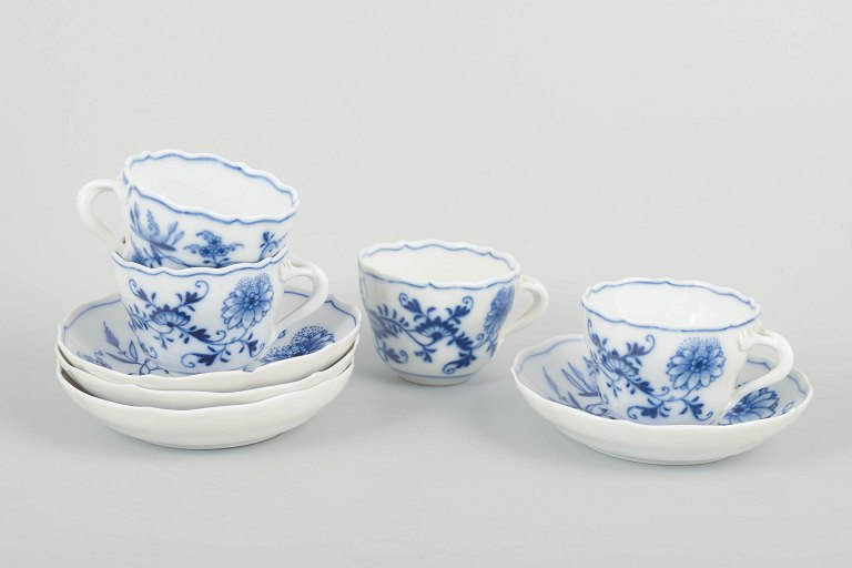 Meissen – “Blue Onion”Set of four demitasse cups with saucers, late 19th century.