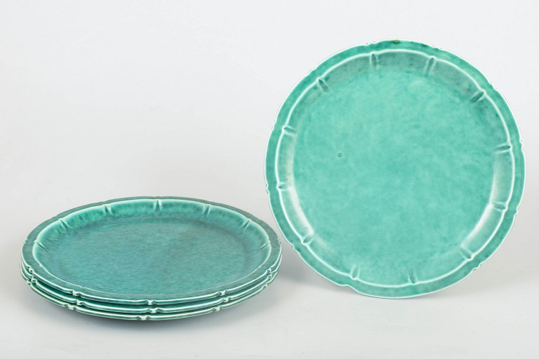 Wilhelm Kåge for Gustavsberg, set of four Art Deco plates.